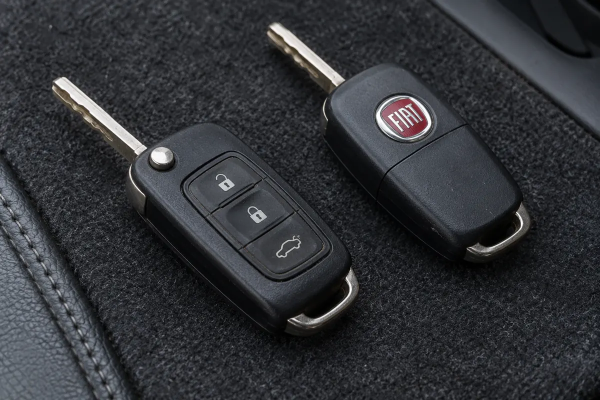 AI illustration showing Fiat remote-key buttons, blades and a spare key.