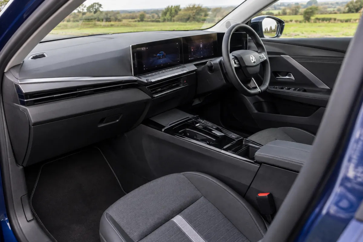 AI illustration of a right-hand-drive Vauxhall Astra cabin, seats and dashboard.