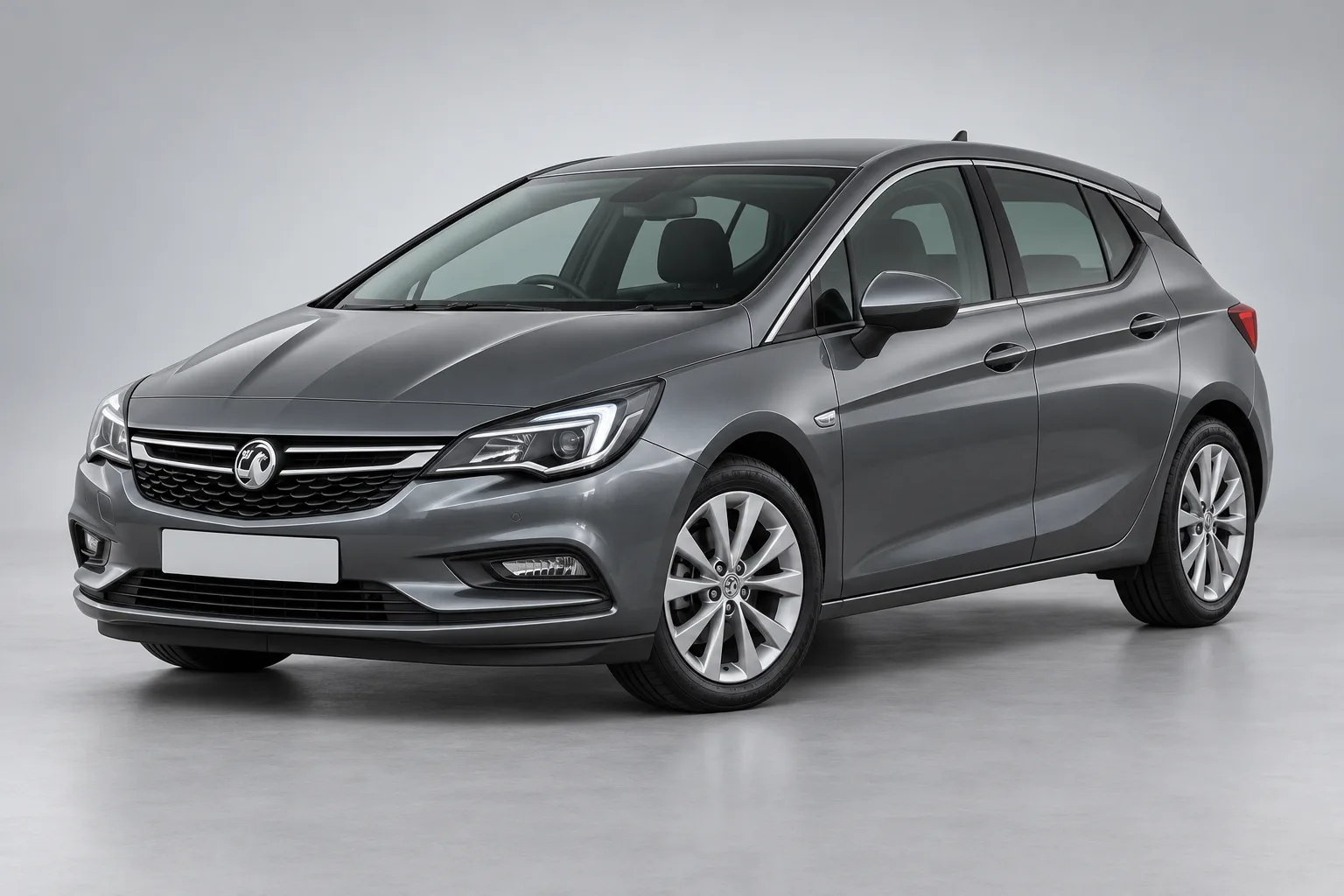 vauxhall astra key replacement – Grey Vauxhall Astra in a studio — illustrative concept image